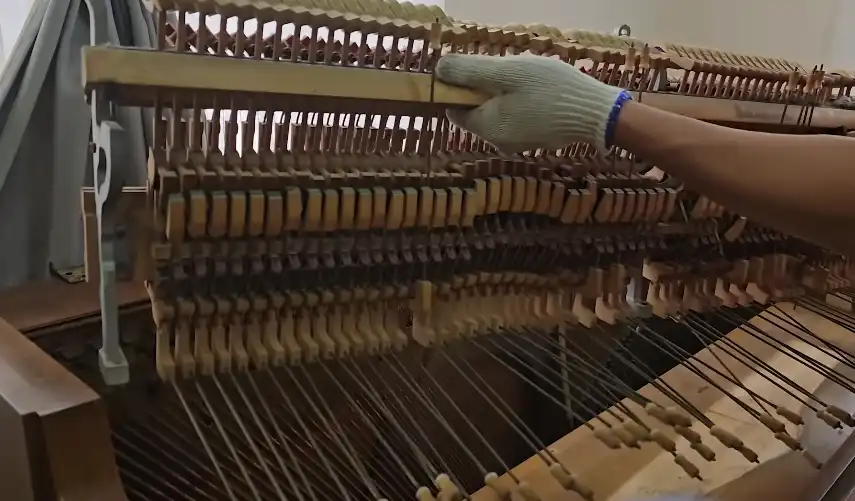 Piano removal Redding CA — crew carefully removing piano parts